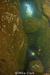 diver exploring Tyes Tunnel, St. Abbs by Mike Clark 